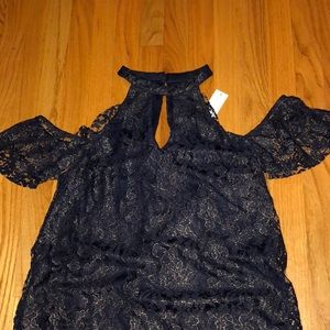 Francesca’s blue and gold high neck dress